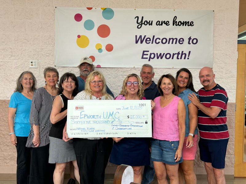 Check presentation attendees shown are in back (l-r) Maureen Knesel, food rescue manager; Lynda Oakes, New Life Thrift Shop committee member; Tom Lewis, food pantry manager; David Streit, Good Samaritan outtake manager; Betsy Fleetwood, LRAC board member; and Mike Tyler, Inviting All Ministry leader. In front are Doreen Healey, NLTS committee member; Andrea Caswell, NLTS manager; Brenda Kasprzewski, LRAC executive director; and Susan Johnson, NLTS committee member. Not shown is Dottie Outland, Food and Love Ministry manager. SUBMITTED PHOTO